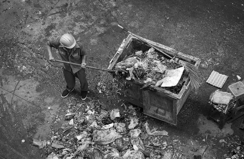 Construction workers managing builders waste onsite in Havering